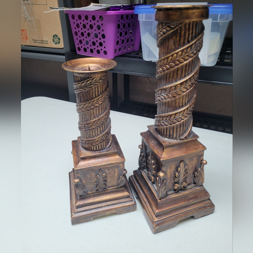 Vintage style pillar candle holders with a twisted column design.